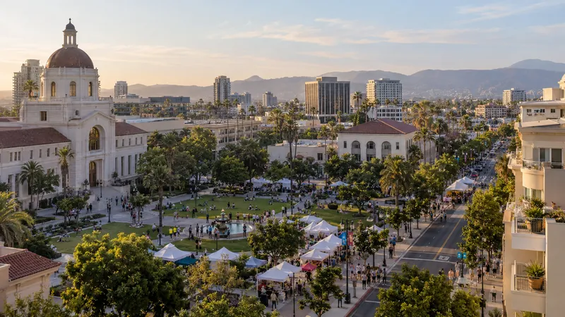 Illustration of a civic plaza and public event with tents, tree-lined streets, and city buildings